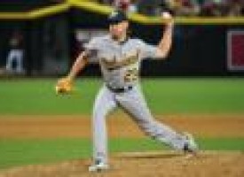 A's switch pitcher Venditte tops D-backs for 1st win