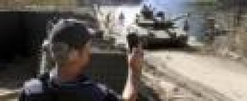 Ukraine starts pull-back of tanks, light artillery in east: military