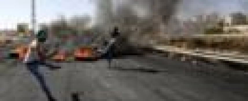 Israeli air strike kills two in Gaza; Israeli police say stop suspected car bomb