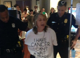 Obama's War on Cancer Patients: Breast cancer patient arrested for protesting TPP 'death sentence' clause